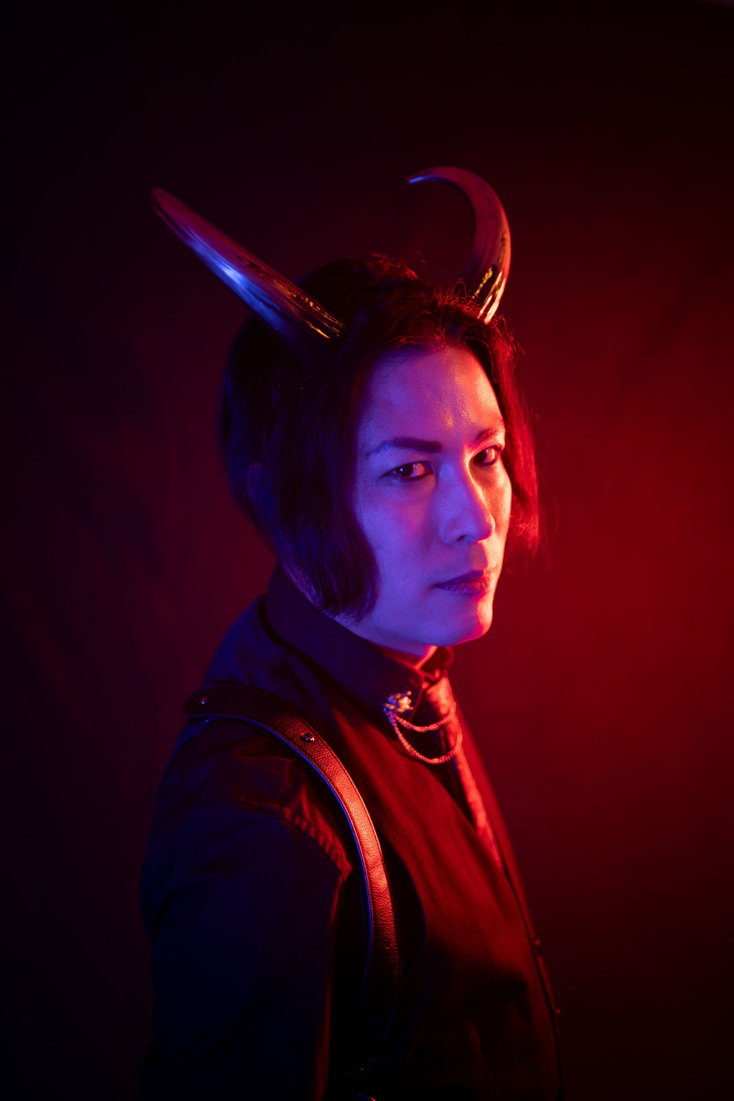 Zeph Rexx models Azazel horns by Haus of Brimstone wearing a gothic black ensemble. Photo by Optic Onslaught.