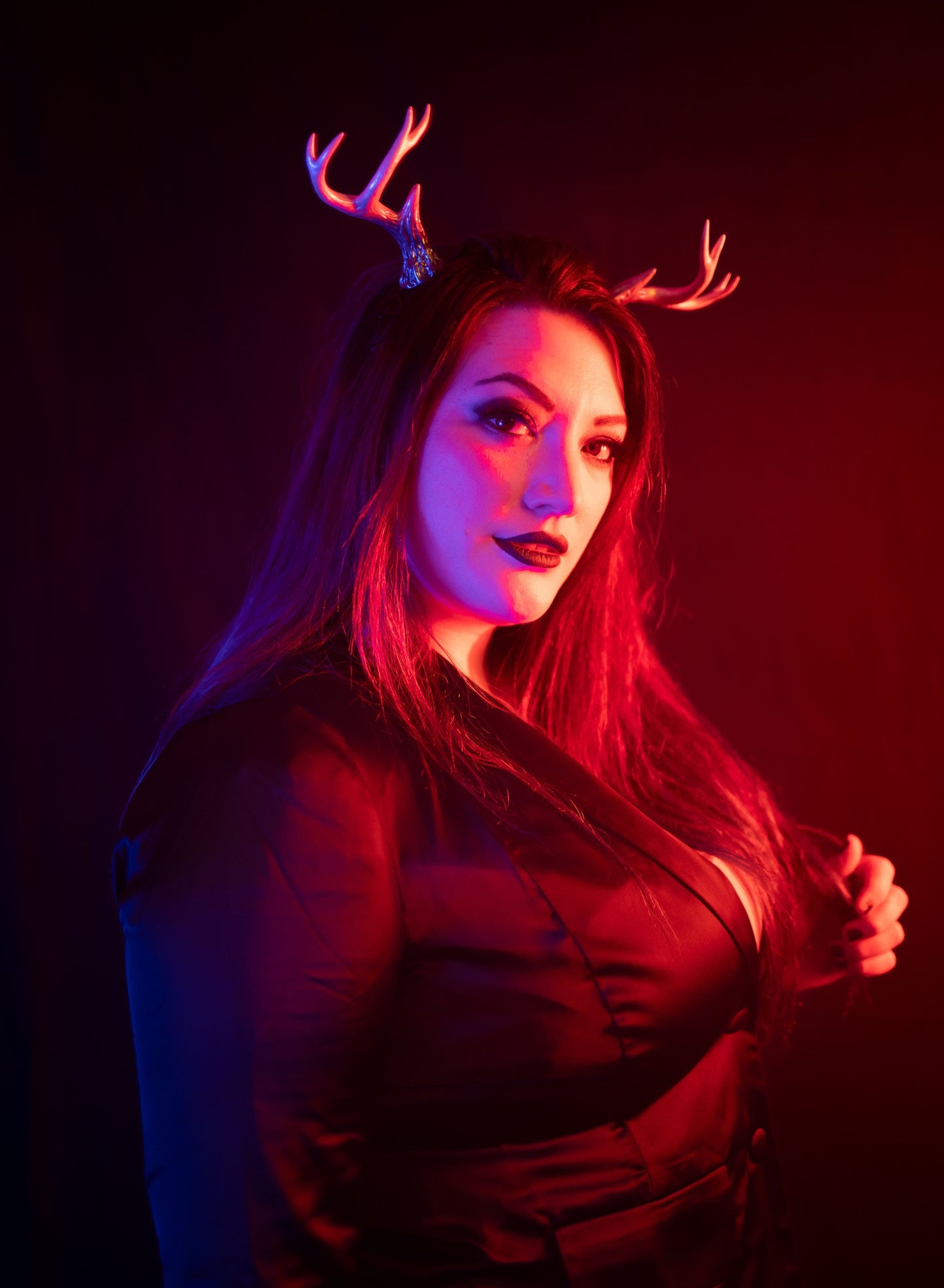 Lady Marionette models Sylvan antlers by Haus of Brimstone in a black corporate goth ensemble. Photo by Optic Onslaught.
