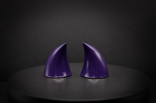 Back view of imp devil horns in belladonna violet, a dark purple with a glossy finish.