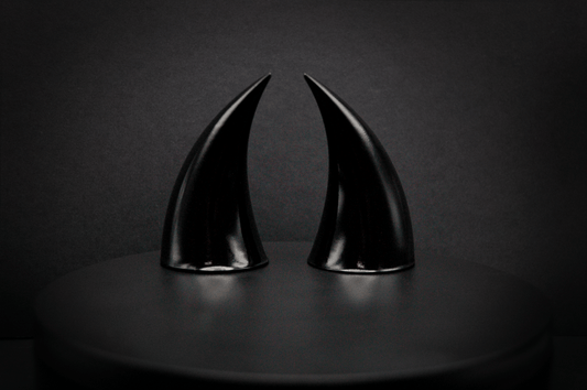 Back view of incubus devil horns in black with a glossy finish.