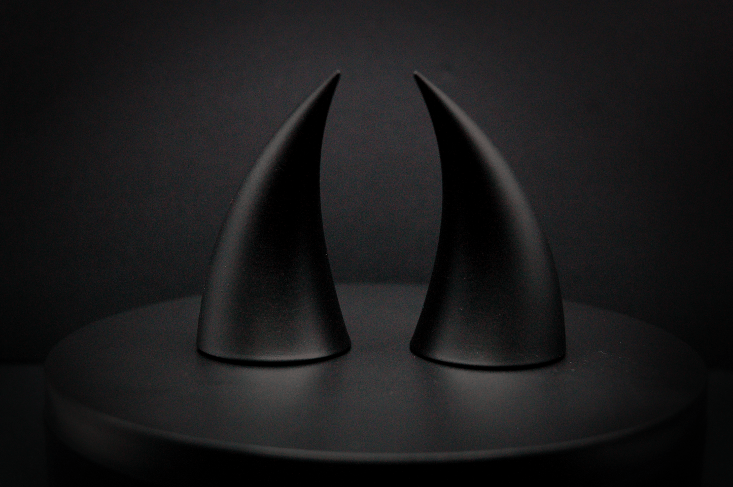 Back view of incubus devil horns in black with a matte finish.