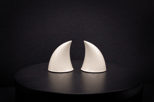 Back view of imp devil horns in bone white with a glossy finish.
