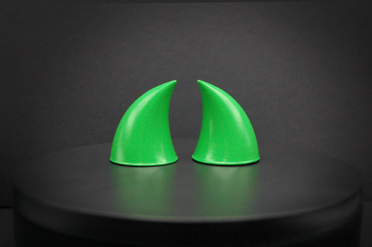 Back view of imp devil horns in goblin green, a bright green with a glossy finish.