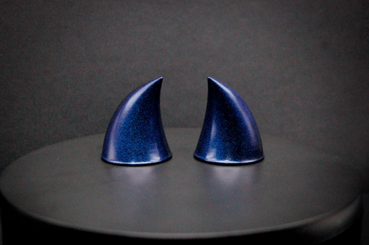 Back view of imp devil horns in metallic violet-blue.