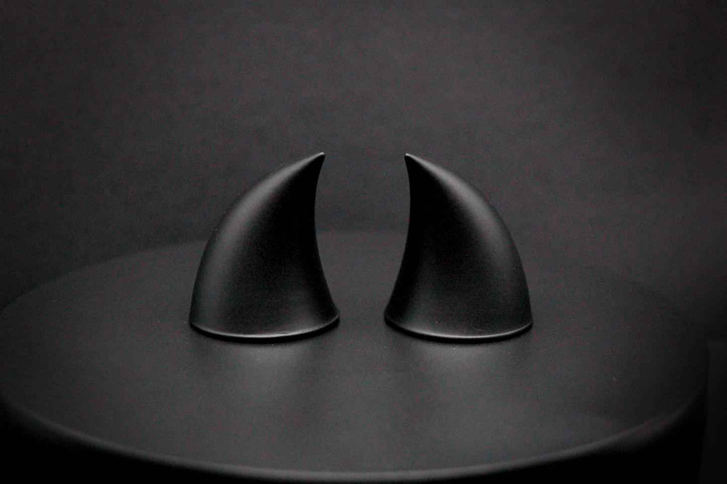 Back view of imp devil horns in black with a matte finish.