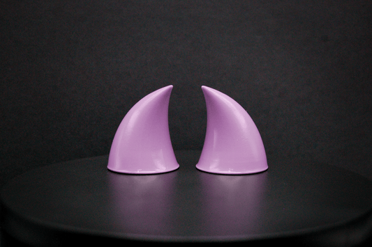 Back view of imp devil horns in lilac with a glossy finish.