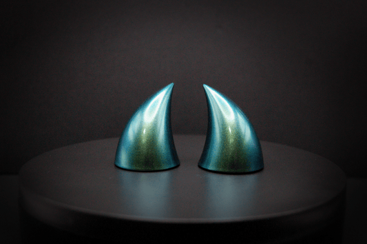 Back view of imp devil horns in metallic blue-green.