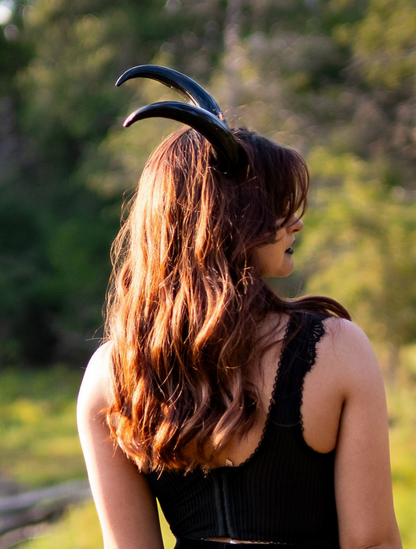 Bambi Bloodmoon models Azazel Horns by Haus of Brimstone in a Texas field at golden hour. Photo by Optic Onslaught.