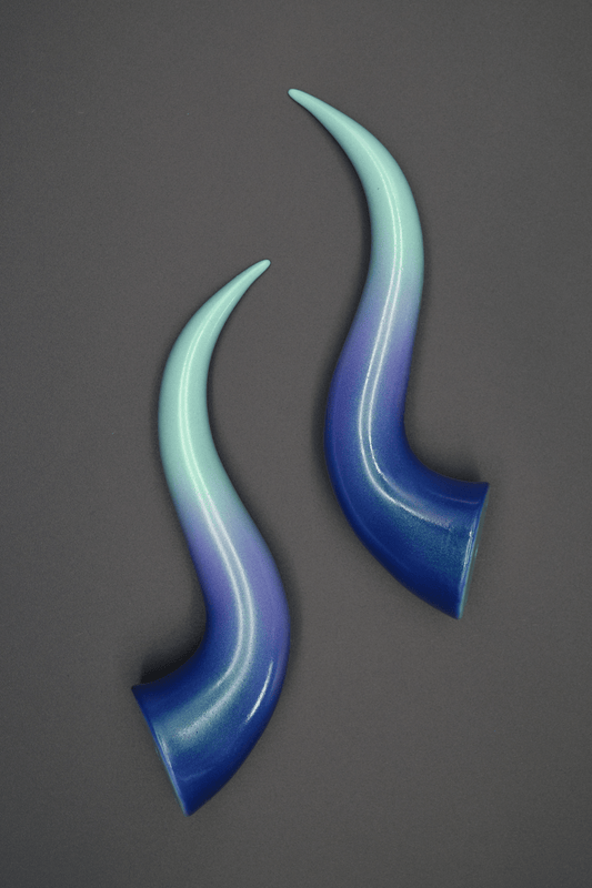 Haus of Brimstone Succubus horns in Haunted Ombré, a blue, violet, and pale green shift with a turquoise shimmer.