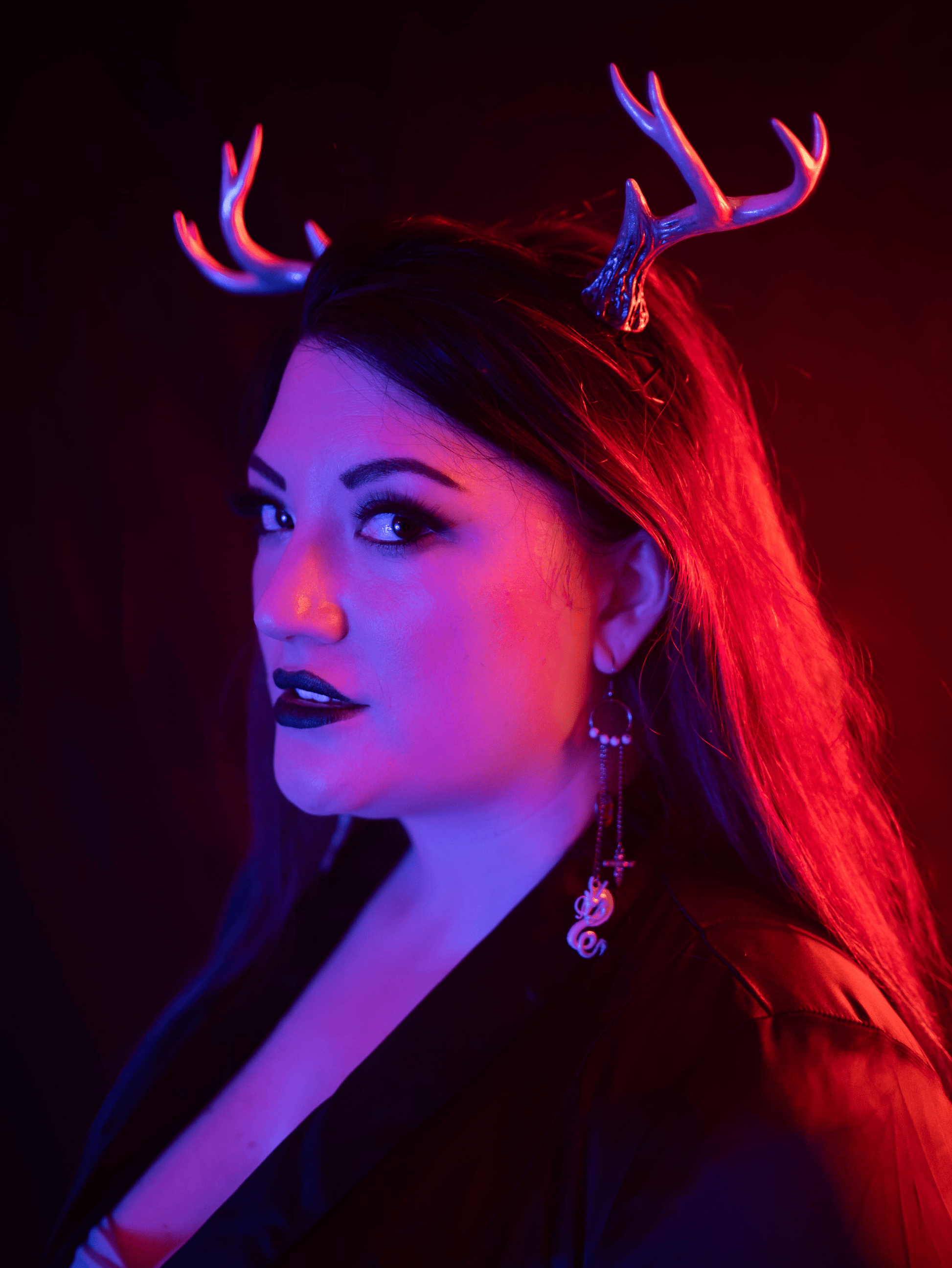 Lady Marionette models Sylvan antlers by Haus of Brimstone in a black corporate goth ensemble. Photo by Optic Onslaught.