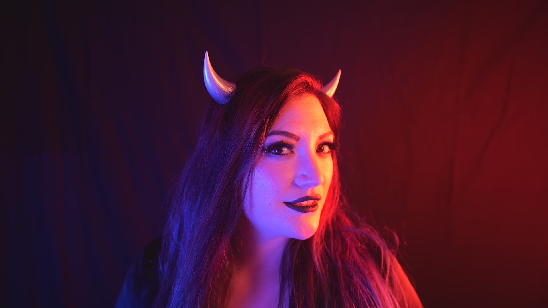 Load video: Lady Marionette models Haus of Brimstone Fiend Horns in a video by Optic Onslaught.