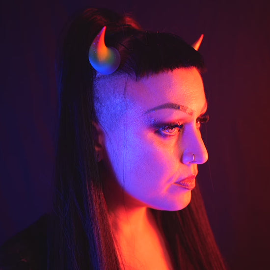 Zoe Sol models Haus of Brimstone Incubus Horns, turning from left to right, in a video by Optic Onslaught. 