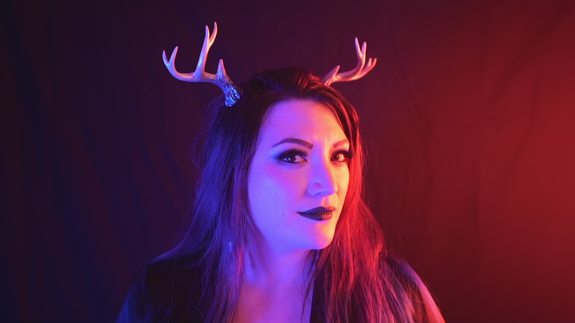 Load video: Lady Marionette models Haus of Brimstone Sylvan Antlers in a video by Optic Onslaught. 