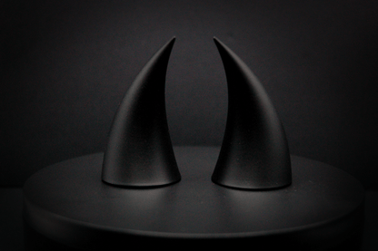 Back view of incubus devil horns in black with a matte finish.