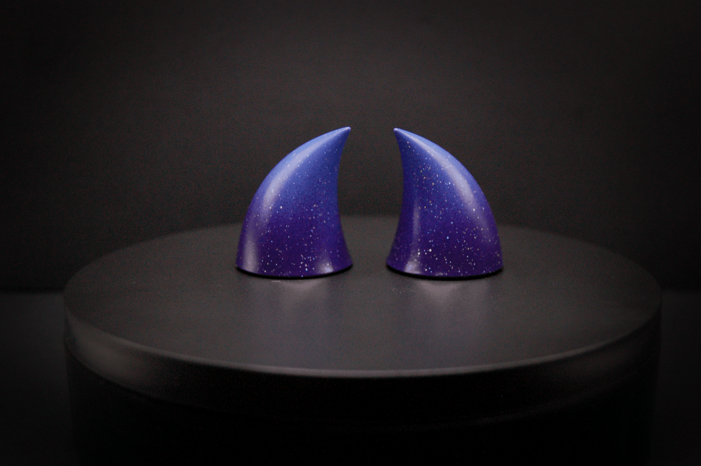 Back view of imp devil horns in a royal purple to periwinkle ombré with a glittery finish.
