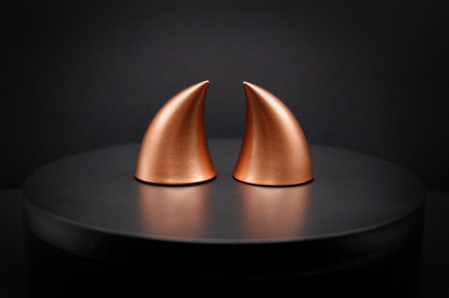 Back view of imp devil horns in metallic copper.