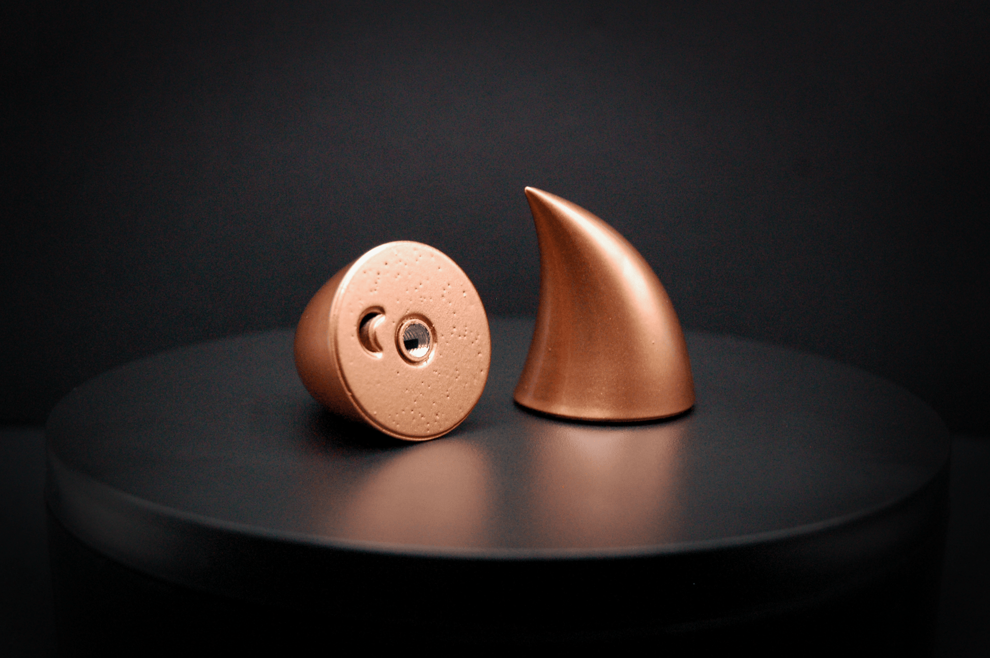 Bottom view of imp devil horns in metallic copper, showing a threaded insert on the base.