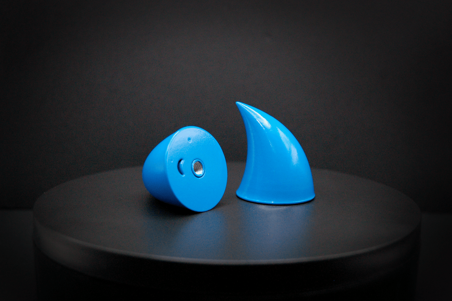 Bottom view of imp devil horns in nixie blue, a turquoise color with a glossy finish, showing a threaded insert on the base.